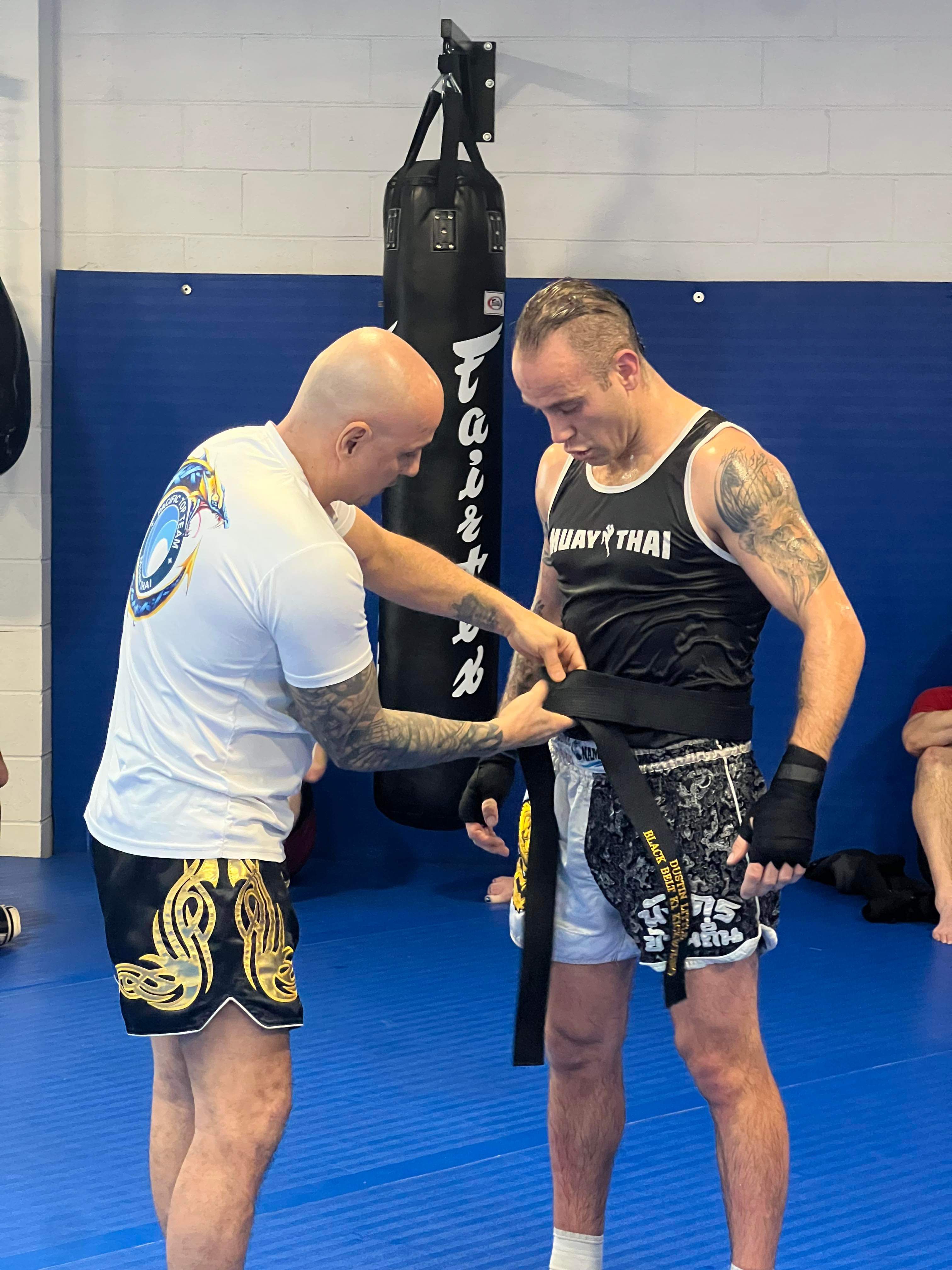 Dustin coaching a client at the gym